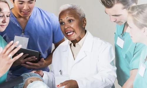 Nurse Educator Teaching Class of Nursing Students